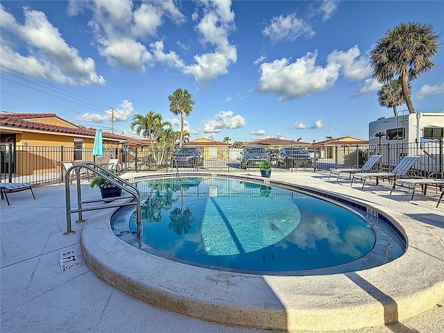 2600 N Paula Dr Unit 2B, Dunedin, FL 34698 - community pool featuring a patio area