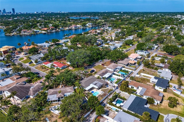 drone / aerial view featuring a water view and a residential view
