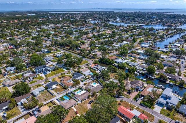 bird's eye view with a residential view and a water view