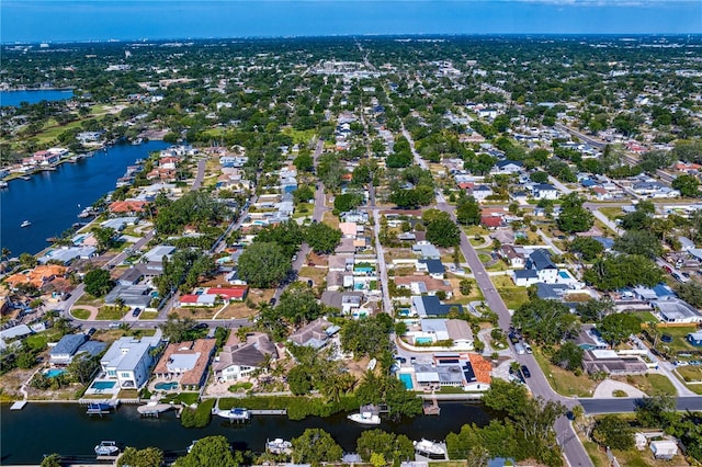 bird's eye view featuring a water view and a residential view