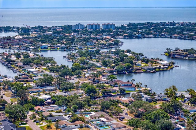 birds eye view of property with a water view and a residential view