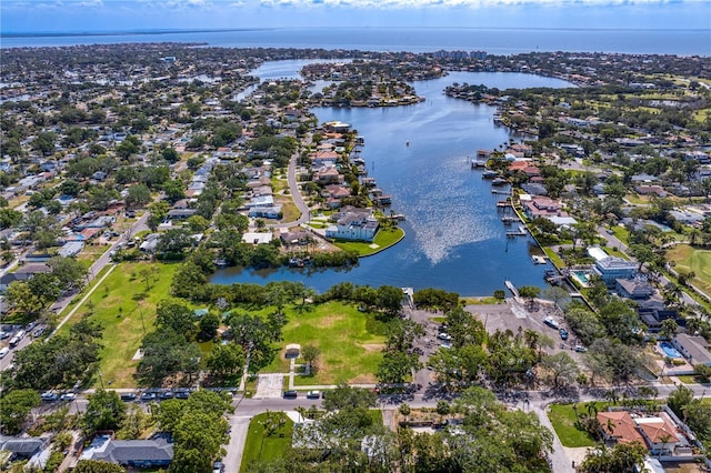 drone / aerial view featuring a water view and a residential view