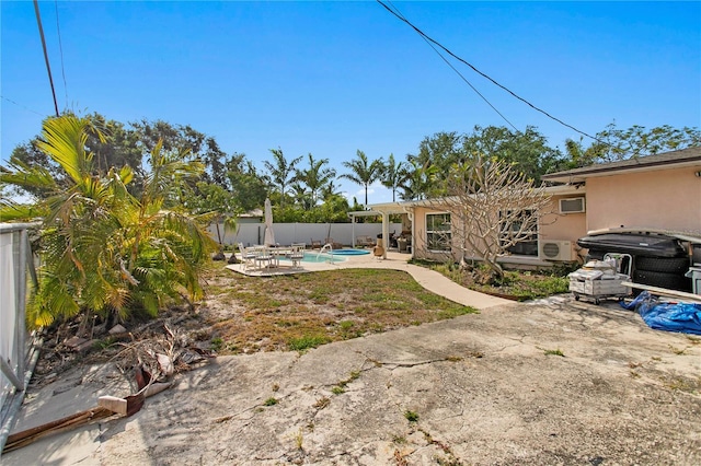 view of yard with a pergola, a fenced backyard, and a patio area