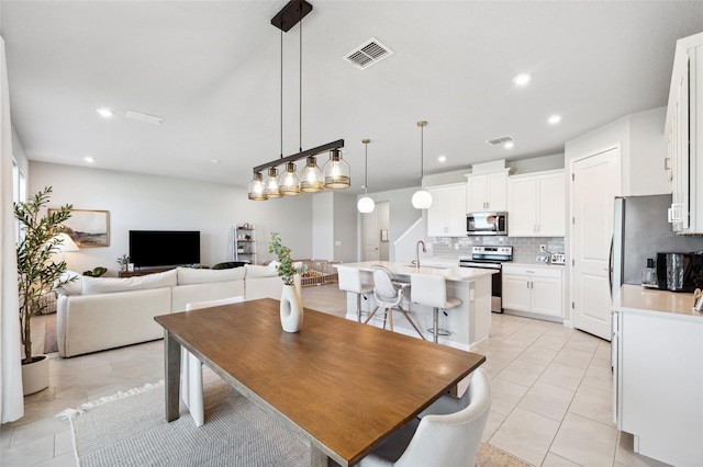 dining area with recessed lighting, light tile patterned flooring, and visible vents