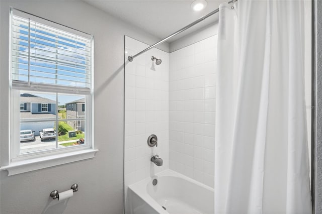 bathroom with shower / tub combo with curtain