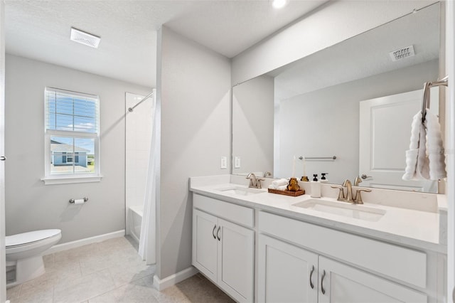 full bath featuring a sink, toilet, double vanity, and visible vents