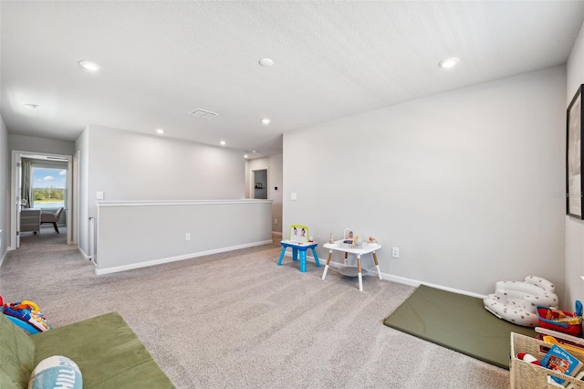 rec room with carpet floors, recessed lighting, baseboards, and visible vents