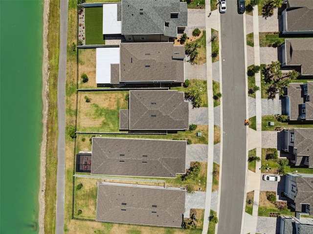 aerial view featuring a residential view and a water view