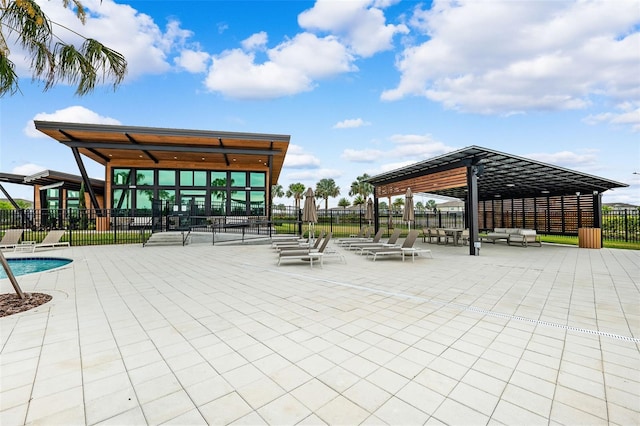 surrounding community featuring a gazebo, a patio area, and fence