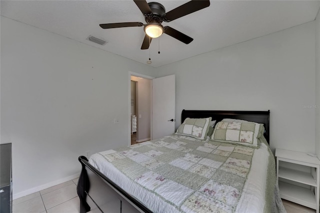 bedroom featuring light tile patterned floors, ceiling fan, and baseboards