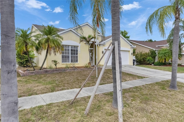 single story home with stucco siding, concrete driveway, an attached garage, and a front lawn