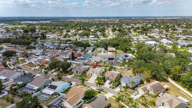 aerial view of property and surrounding area with nearby suburban area