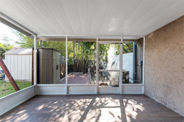unfurnished sunroom with plenty of natural light