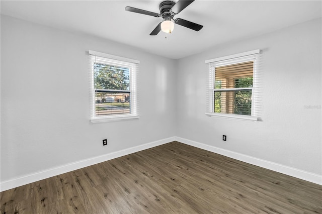 unfurnished room featuring baseboards, a ceiling fan, and wood finished floors