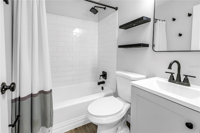 full bathroom with vanity, toilet, wood finished floors, and shower / bath combo