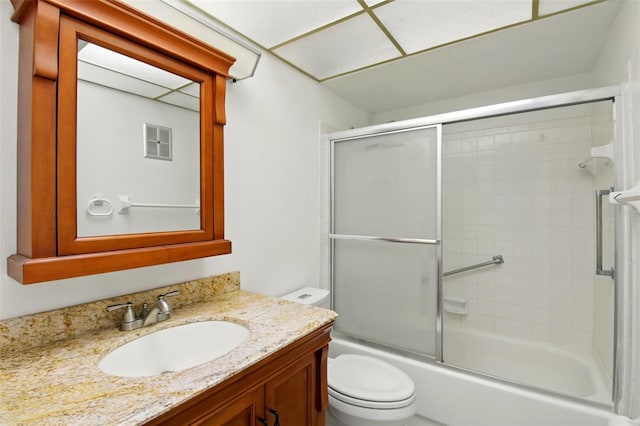 full bathroom with toilet, combined bath / shower with glass door, visible vents, and vanity