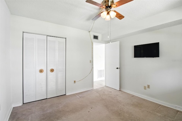 unfurnished bedroom with visible vents, baseboards, and carpet floors