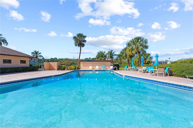 community pool with a patio area