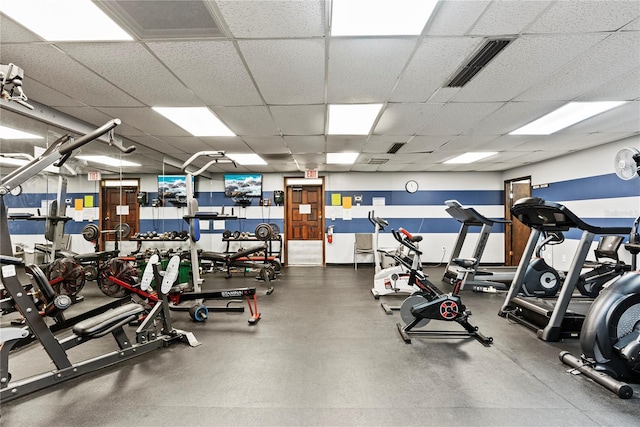 workout area with visible vents and a drop ceiling