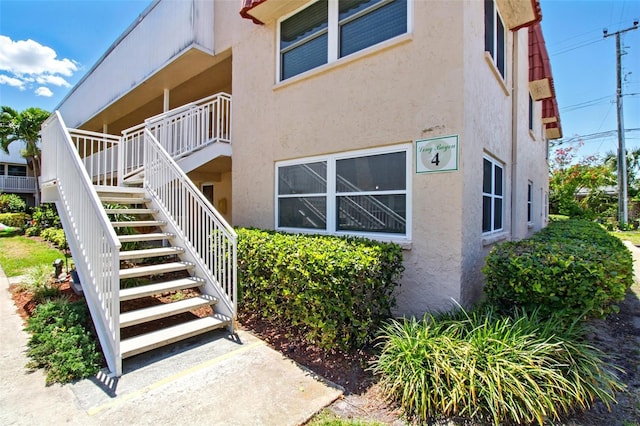 view of property featuring stairs