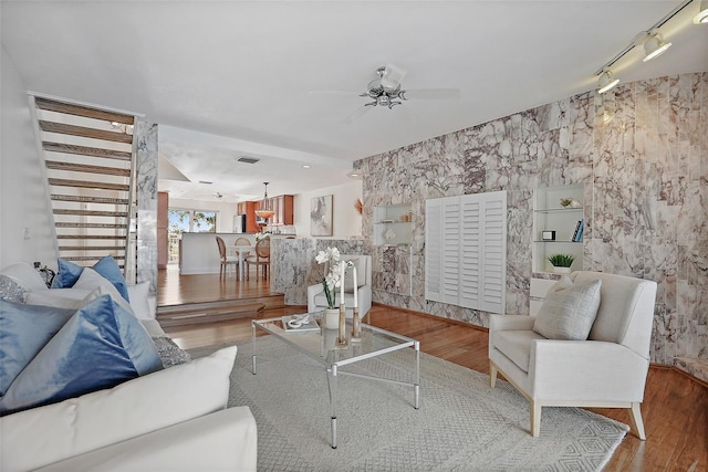 936 Pinellas Bayway S Unit T-5, Tierra Verde, FL 33715 - living area with wood finished floors, rail lighting, and a ceiling fan
