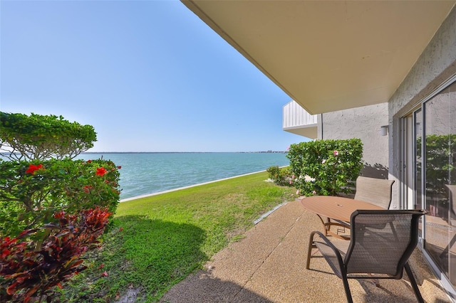 1301 Gulf Blvd Unit 107, Clearwater Beach, FL 33767 - view of patio / terrace featuring a water view