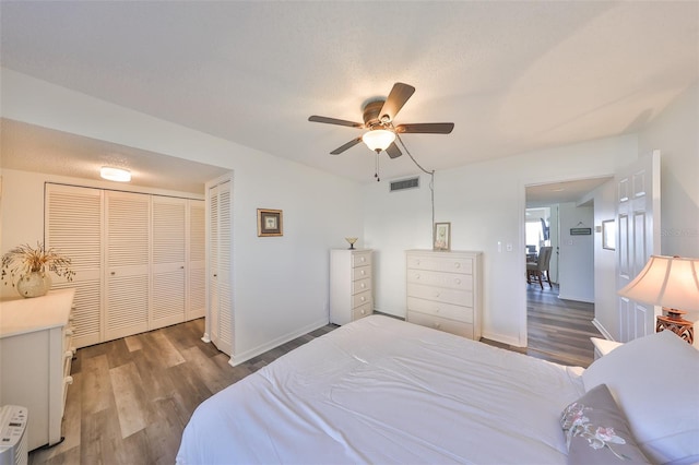 1301 Gulf Blvd Unit 107, Clearwater Beach, FL 33767 - bedroom with wood finished floors, a closet, a ceiling fan, and baseboards