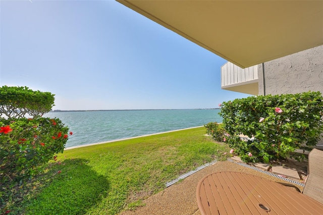 1301 Gulf Blvd Unit 107, Clearwater Beach, FL 33767 - view of grassy yard featuring a water view