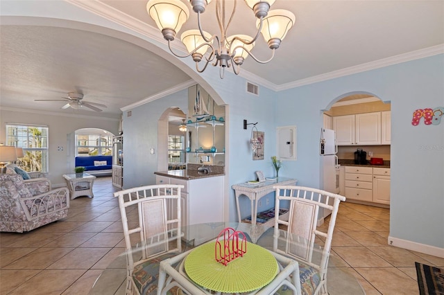 19417 Gulf Blvd Unit E217, Indian Rocks Beach, FL 33785 - dining space featuring visible vents, light tile patterned floors, arched walkways, crown molding, and ceiling fan with notable chandelier