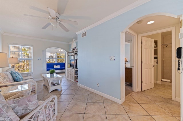 19417 Gulf Blvd Unit E217, Indian Rocks Beach, FL 33785 - living area featuring arched walkways, ornamental molding, visible vents, and light tile patterned floors