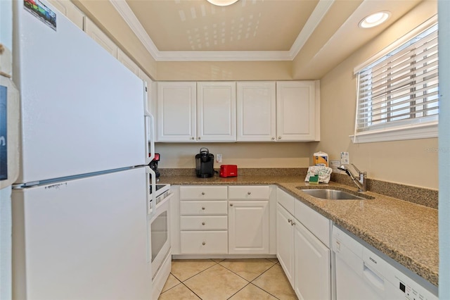 19417 Gulf Blvd Unit E217, Indian Rocks Beach, FL 33785 - kitchen featuring white cabinetry, light tile patterned floors, a sink, and white appliances