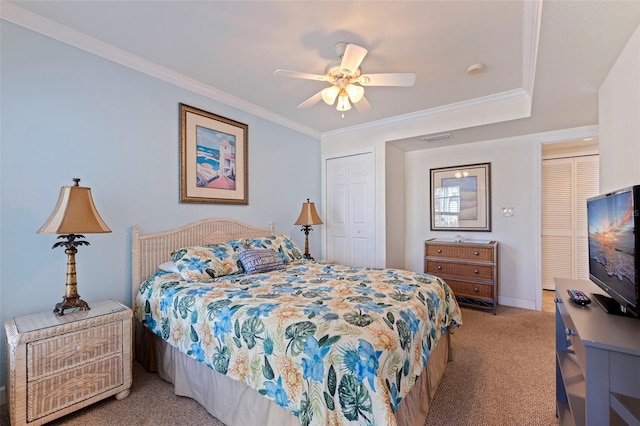 19417 Gulf Blvd Unit E217, Indian Rocks Beach, FL 33785 - bedroom with visible vents, a ceiling fan, light carpet, crown molding, and baseboards