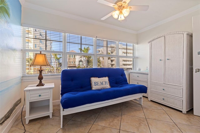 19417 Gulf Blvd Unit E217, Indian Rocks Beach, FL 33785 - living area featuring a healthy amount of sunlight, a ceiling fan, ornamental molding, and light tile patterned floors