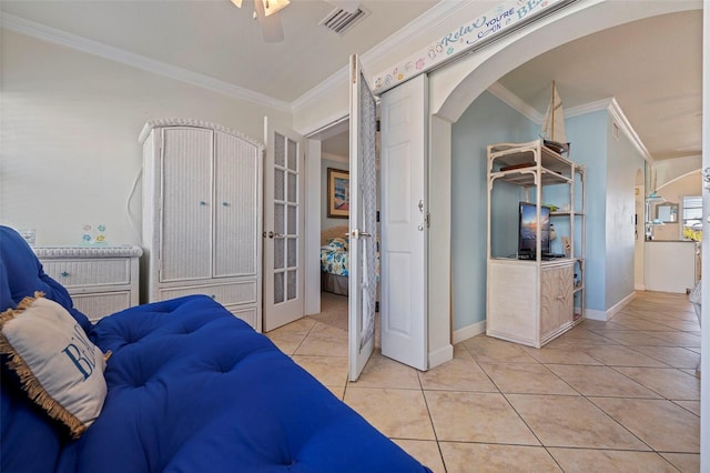 19417 Gulf Blvd Unit E217, Indian Rocks Beach, FL 33785 - bedroom with french doors, visible vents, ornamental molding, ceiling fan, and light tile patterned floors
