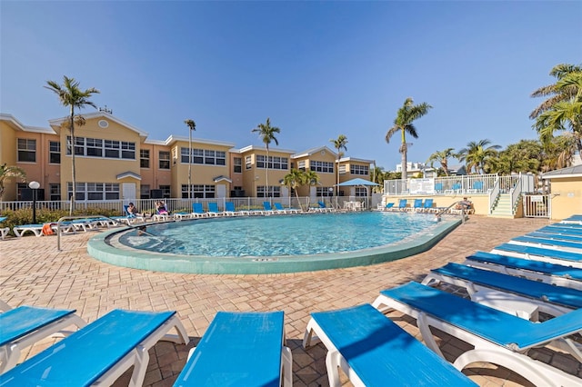 19417 Gulf Blvd Unit E217, Indian Rocks Beach, FL 33785 - community pool with fence and a patio area