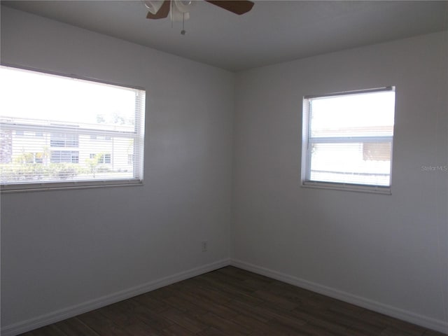 433 73rd Ave N, Saint Petersburg, FL 33702 - unfurnished room featuring a ceiling fan, baseboards, and dark wood-style flooring
