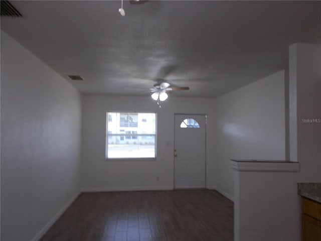 433 73rd Ave N, Saint Petersburg, FL 33702 - entryway with visible vents, baseboards, wood finished floors, and ceiling fan
