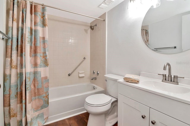 1400 Pine Glen Ln Unit B2, Tarpon Springs, FL 34688 - bathroom with toilet, visible vents, shower / bath combo with shower curtain, wood finished floors, and vanity