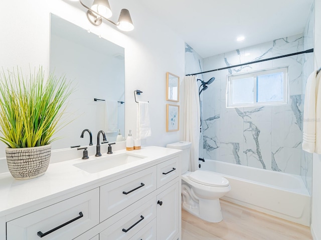 bathroom featuring toilet, vanity, wood finished floors, and shower / bathtub combination with curtain