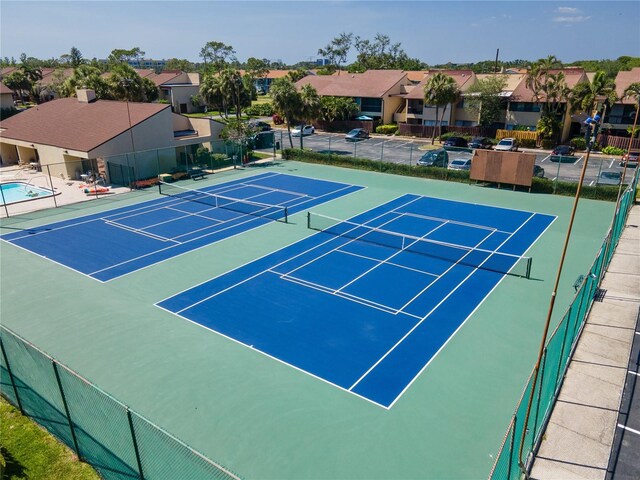 782 Village Lake Ter N Unit 102, Saint Petersburg, FL 33716 - view of tennis court with a residential view