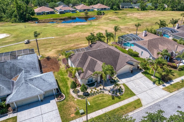 bird's eye view featuring a water view and a residential view