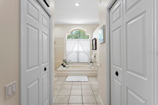 bathroom with a bath, tile patterned flooring, a closet, and recessed lighting