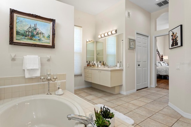 full bathroom with tile patterned floors, visible vents, vanity, and a bath