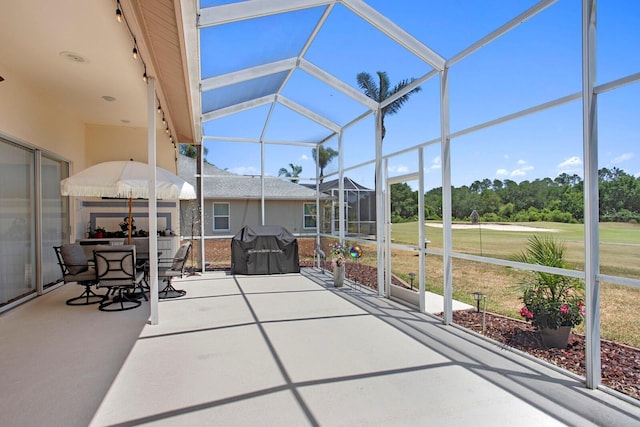 sunroom / solarium with outdoor dining space