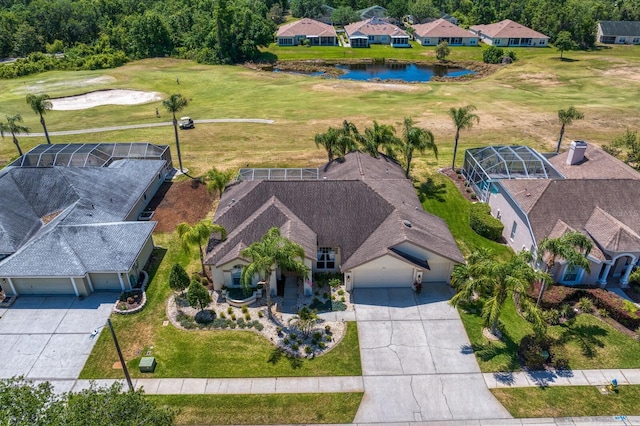 aerial view with a residential view, a water view, and view of golf course