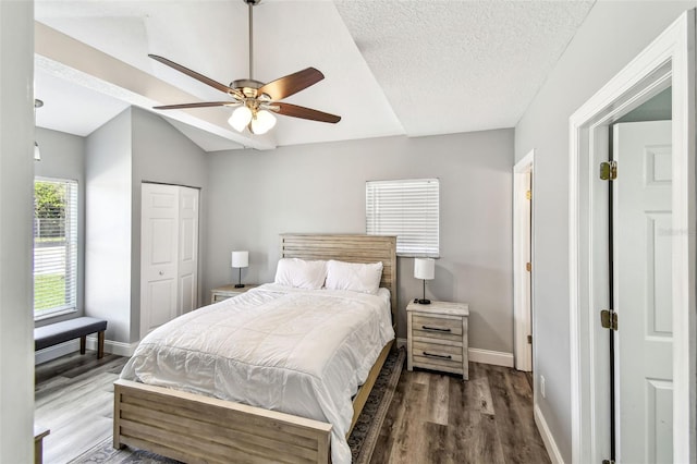 6207 Gulfport Blvd S, Gulfport, FL 33707 - bedroom featuring a textured ceiling, baseboards, a ceiling fan, wood finished floors, and a closet