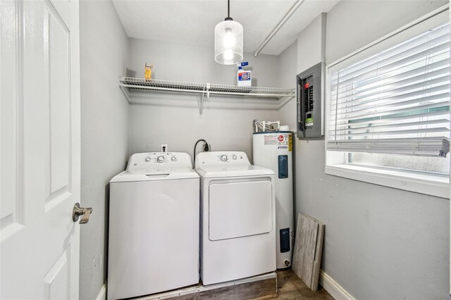 6207 Gulfport Blvd S, Gulfport, FL 33707 - clothes washing area featuring electric water heater, separate washer and dryer, electric panel, laundry area, and dark wood-style floors
