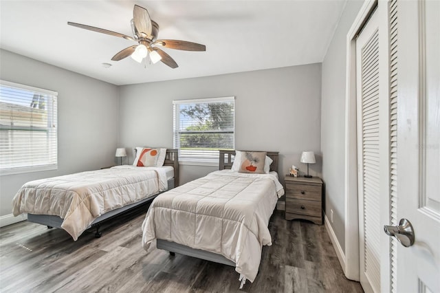 6207 Gulfport Blvd S, Gulfport, FL 33707 - bedroom with baseboards, wood finished floors, a closet, and ceiling fan