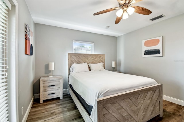 6207 Gulfport Blvd S, Gulfport, FL 33707 - bedroom featuring ceiling fan, baseboards, wood finished floors, and visible vents