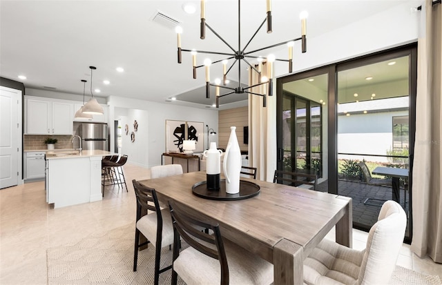 dining area with light tile patterned floors, a notable chandelier, visible vents, and recessed lighting